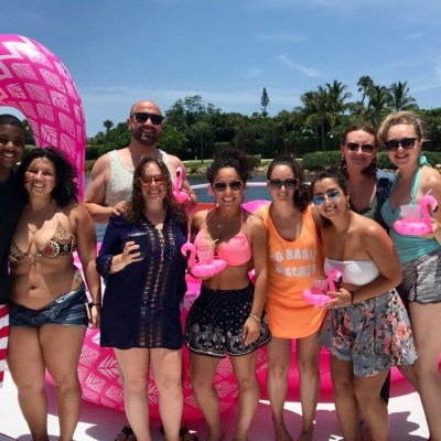 a group with a giant flamingo floatation device in west palm beach