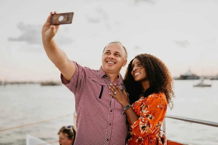 a person standing next to a body of water
