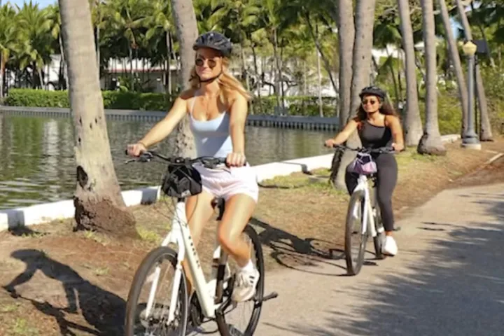 a person riding on the back of a bicycle