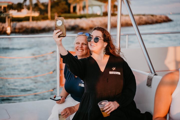 a person standing next to a body of water