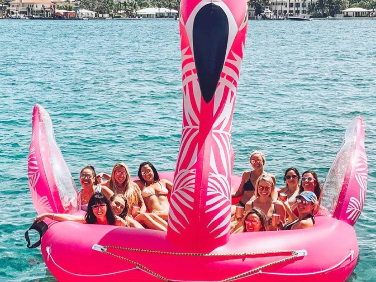 a group of people in a boat on a body of water