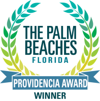 Logo with blue-green laurel wreath, text 'The Palm Beaches Florida Providencia Award Winner'.