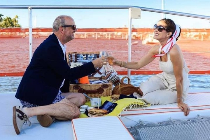 a man and a woman sitting on a table