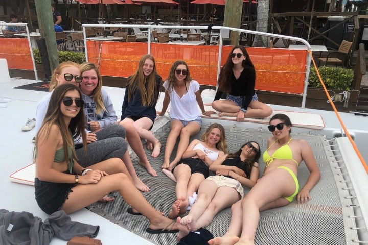 a group of people sitting on a bench