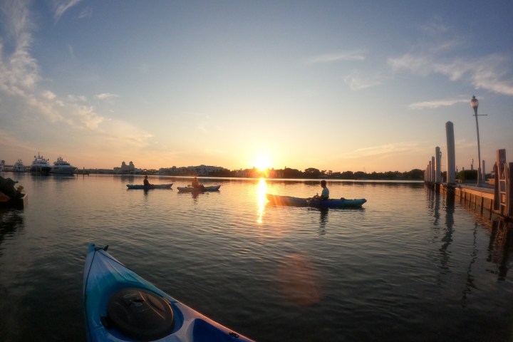 a boat is docked next to a body of water