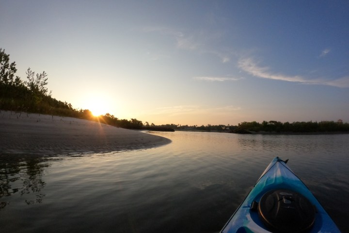 a sunset over a body of water