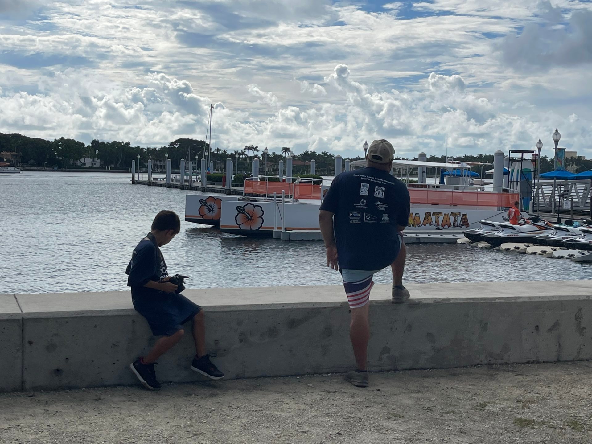 a group of people standing on top of a sandy beach