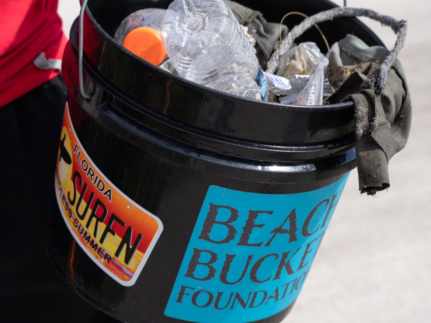 a woman standing next to a bowl of food