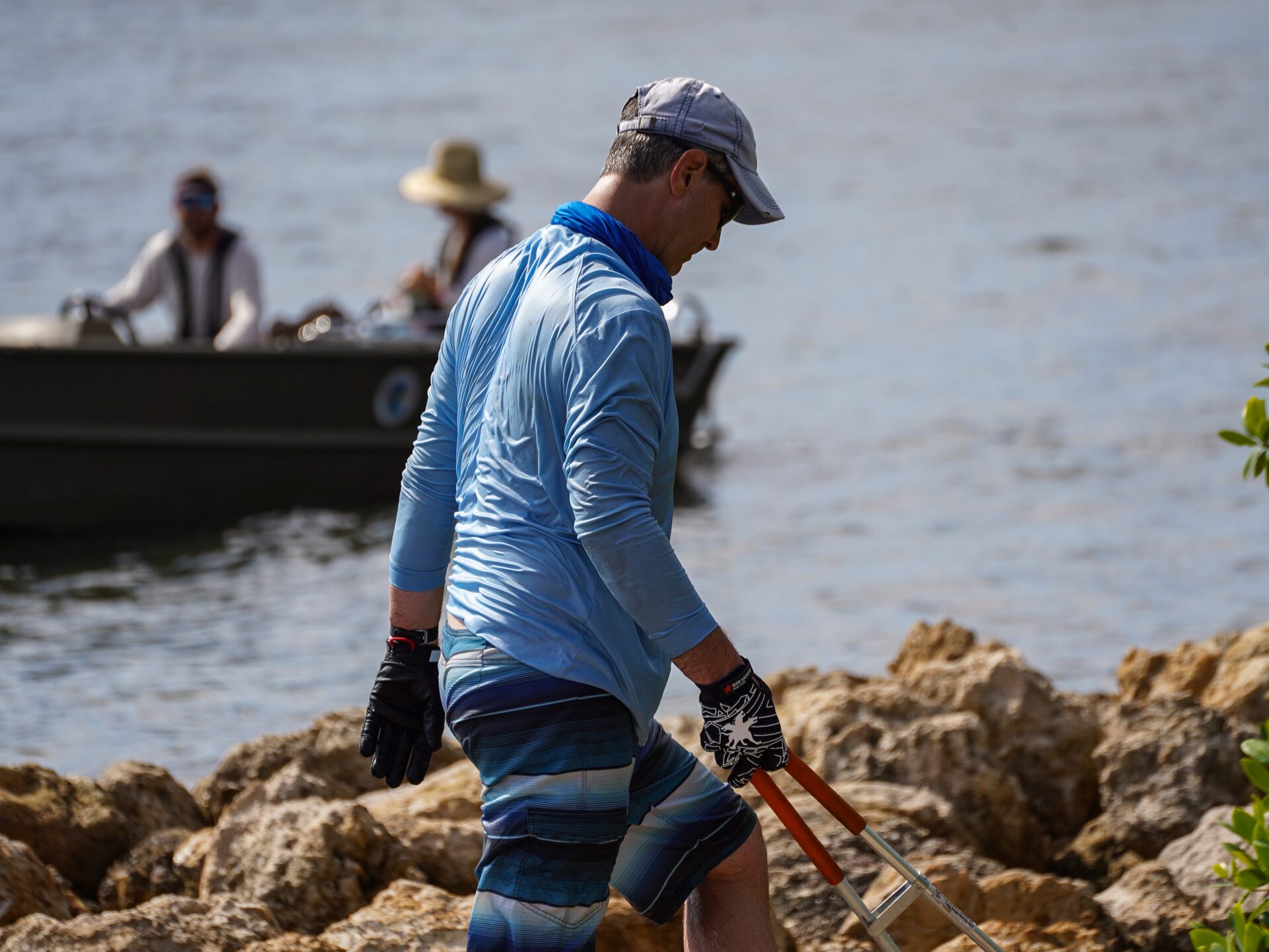 a person standing next to a body of water