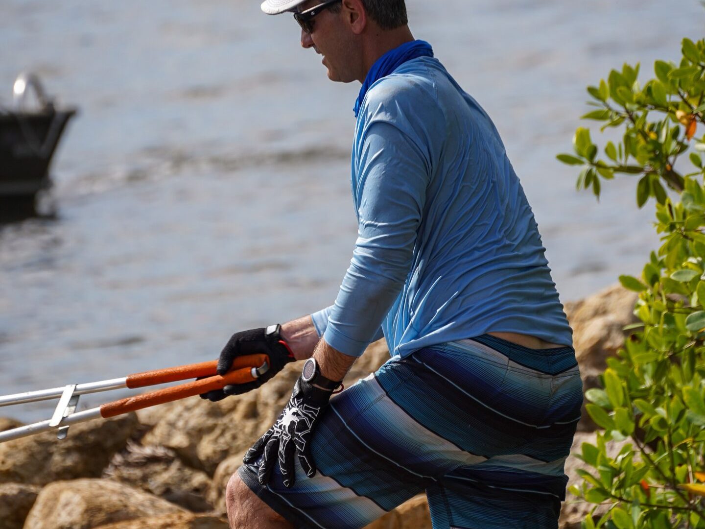 a person standing next to a body of water