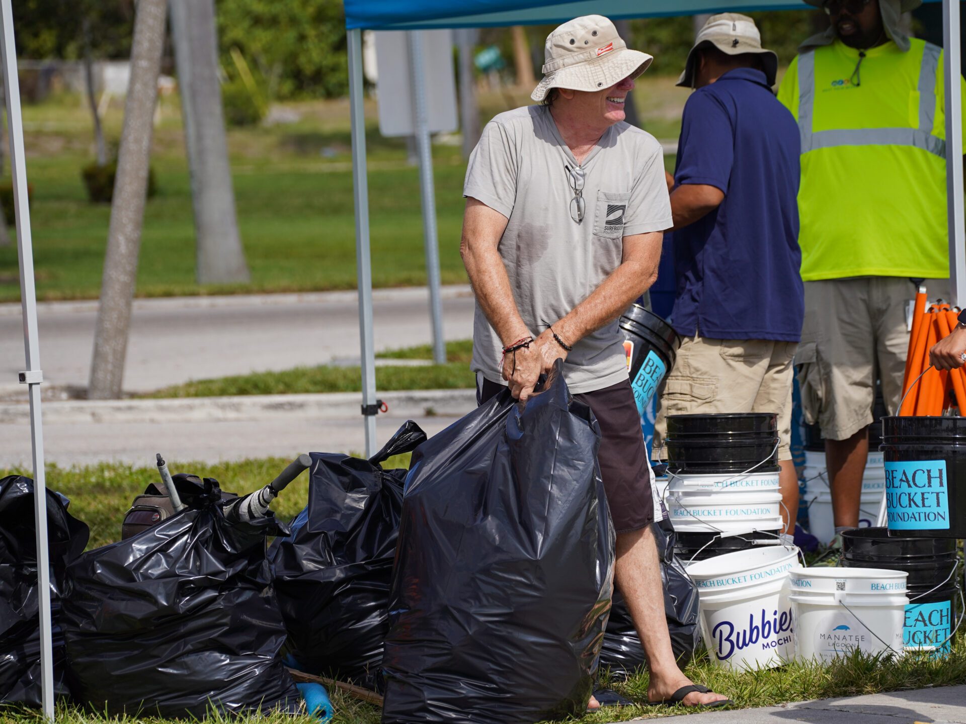 a couple of people that are standing in the grass