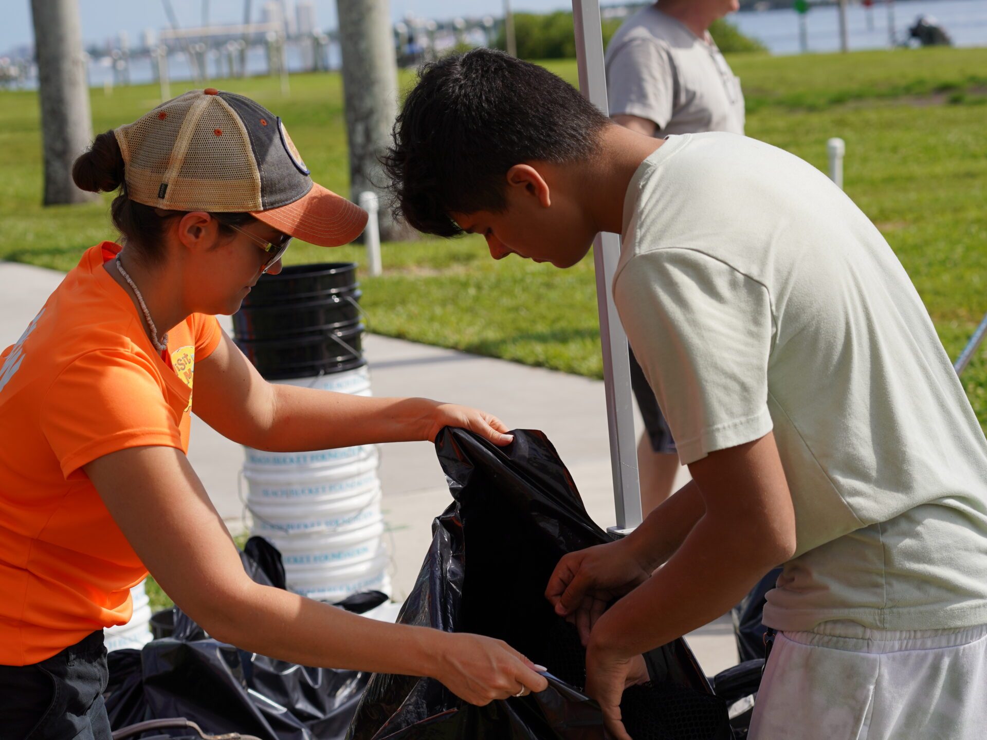 a group of people looking at a cell phone
