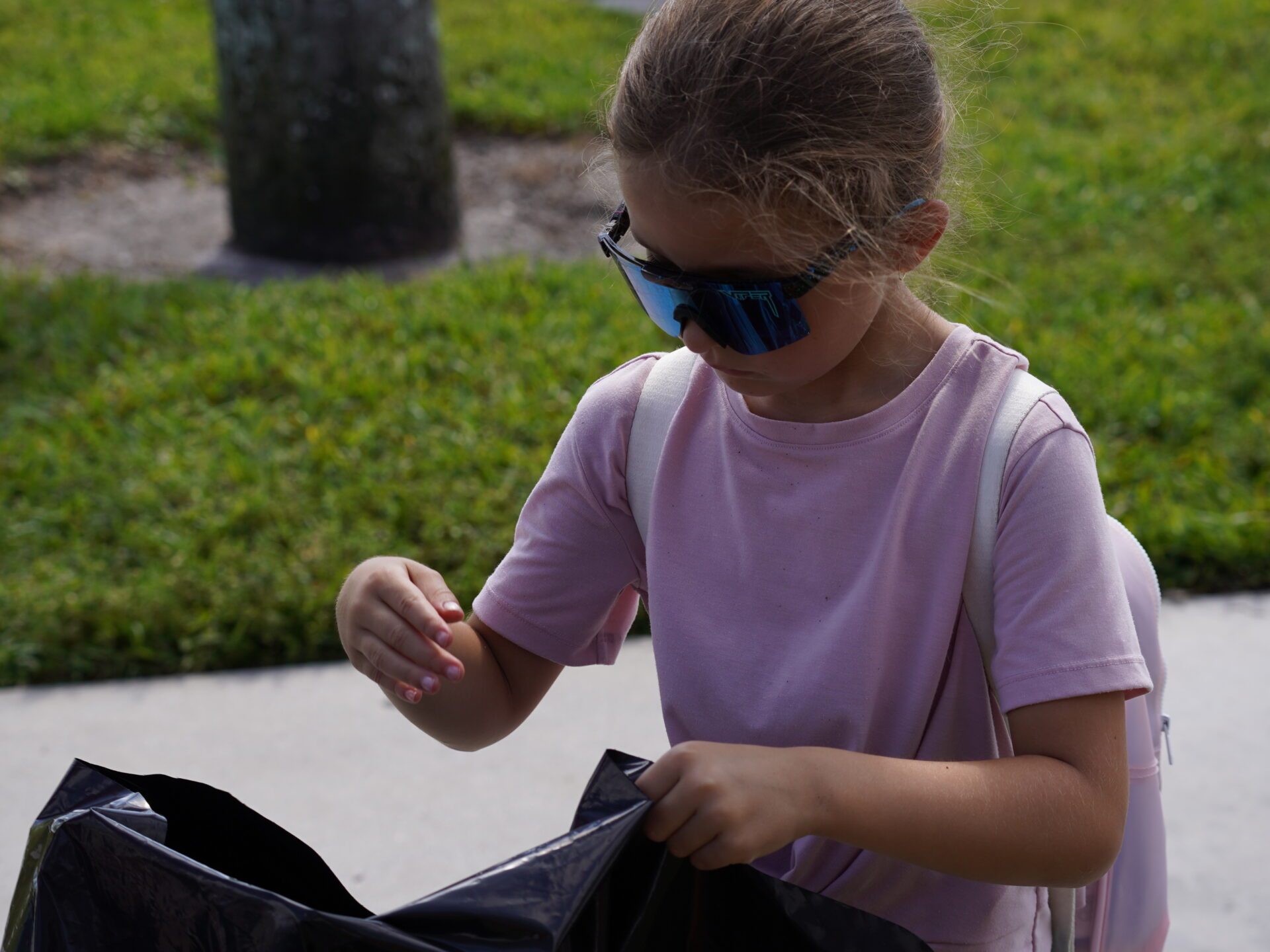 a little boy that is standing in the grass