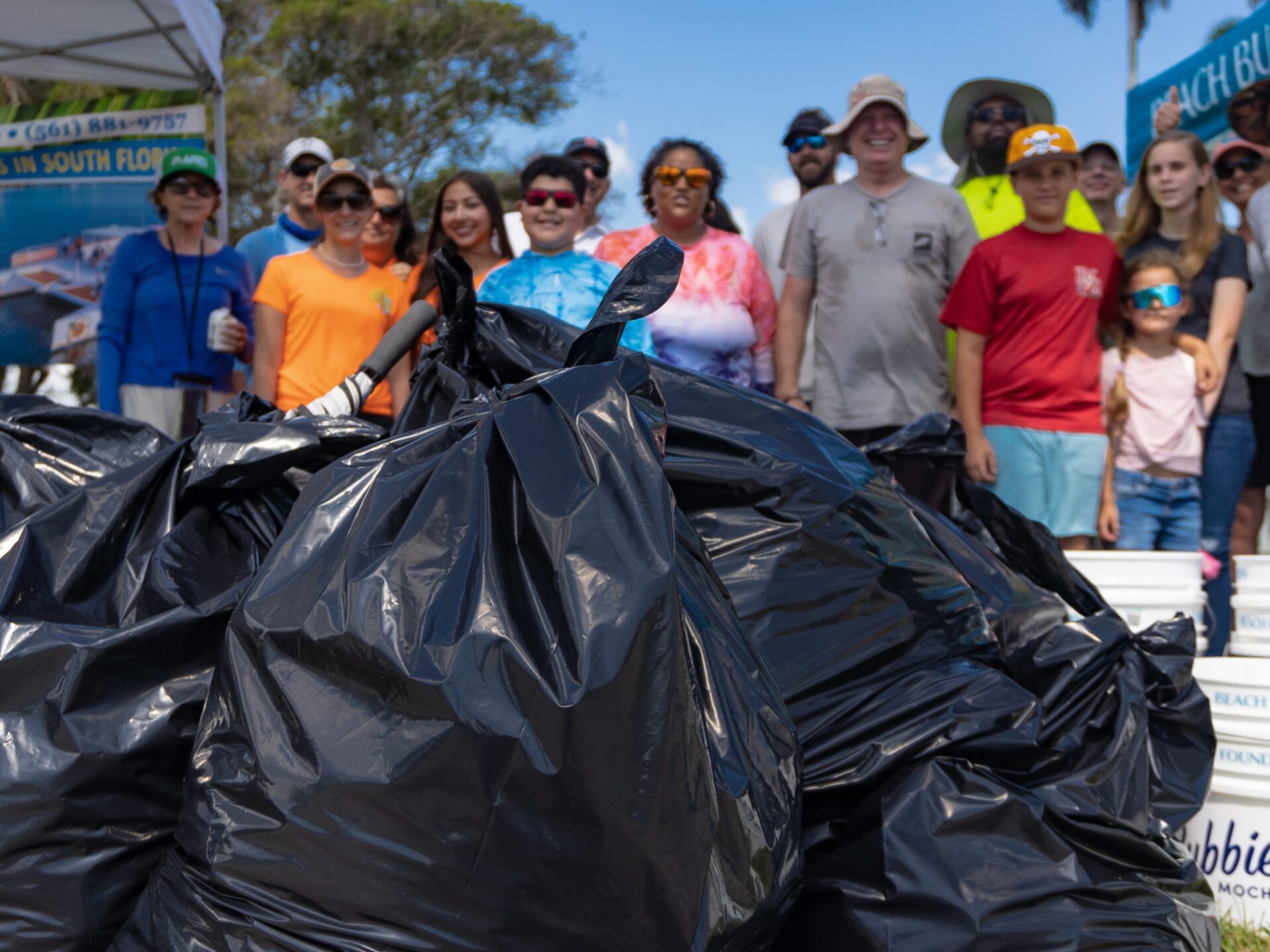 a group of people standing around a motorcycle