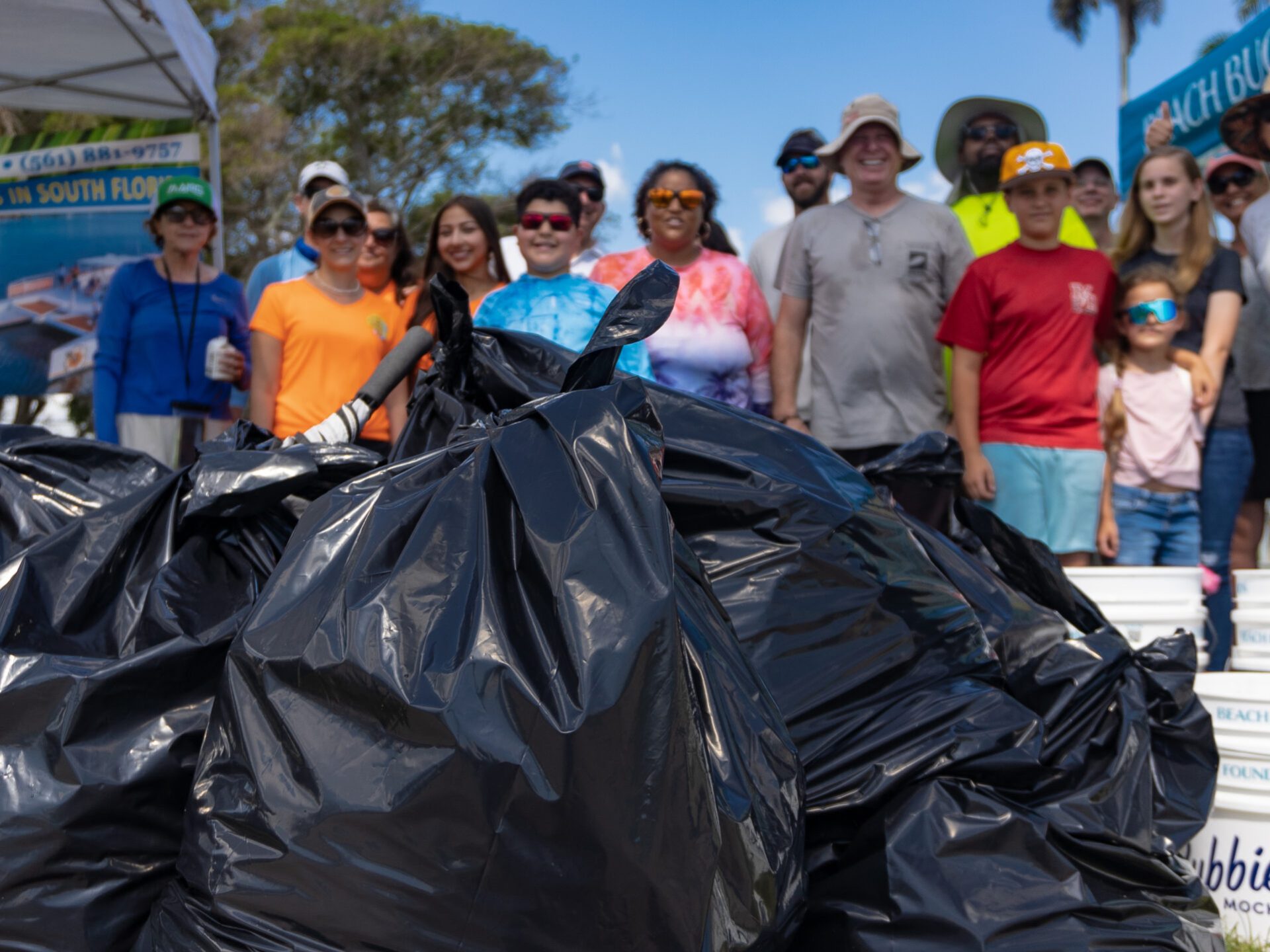 a group of people standing around a motorcycle
