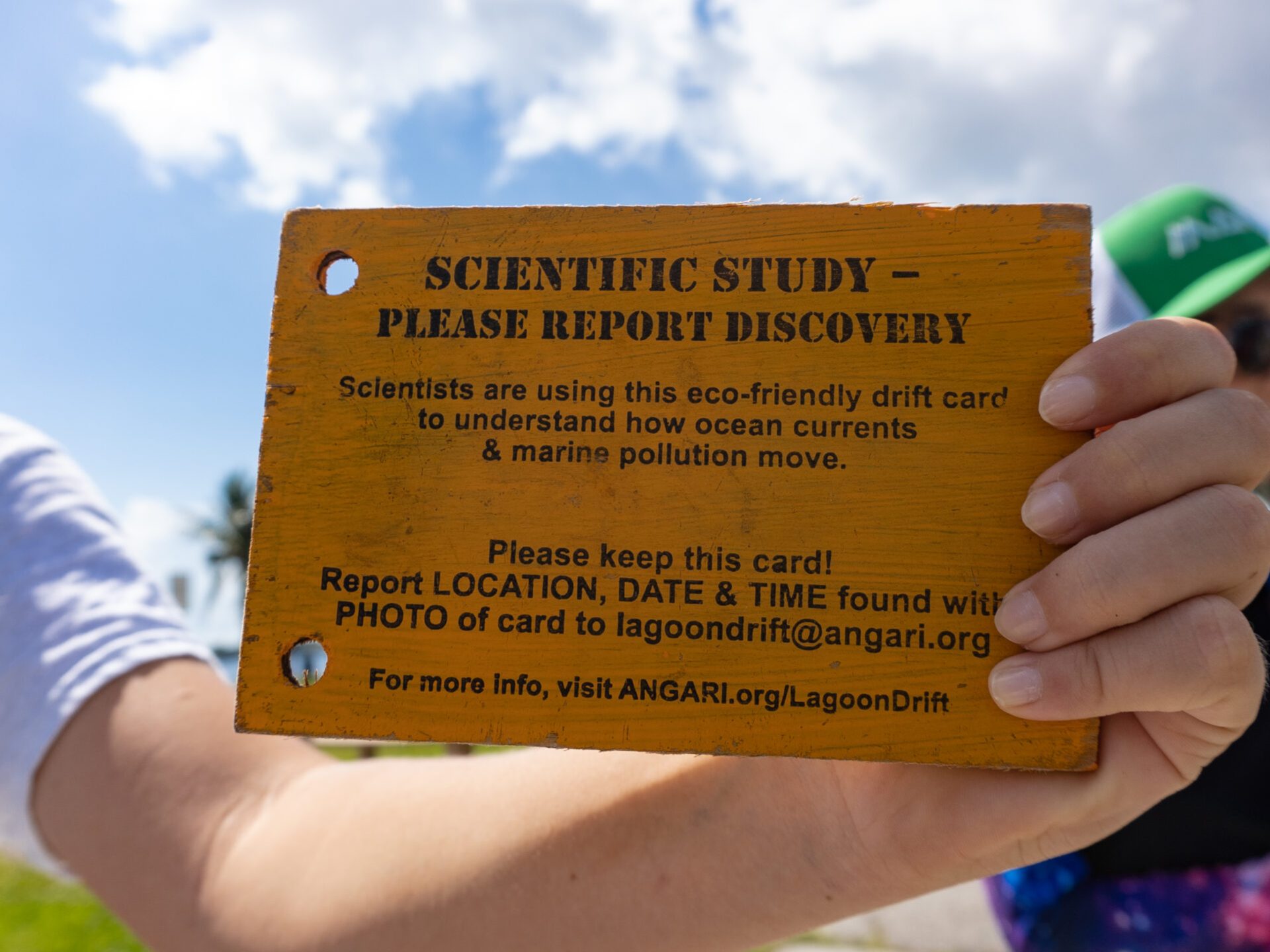 a man holding a sign