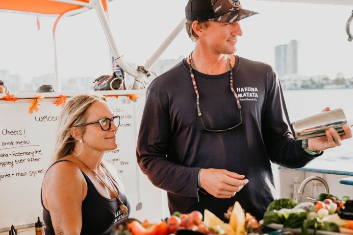 a woman standing in front of a plate of food
