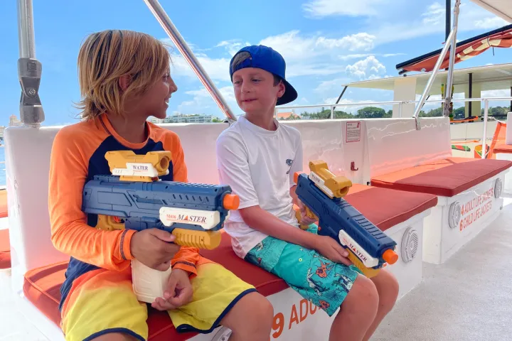 a man and a woman sitting on a boat