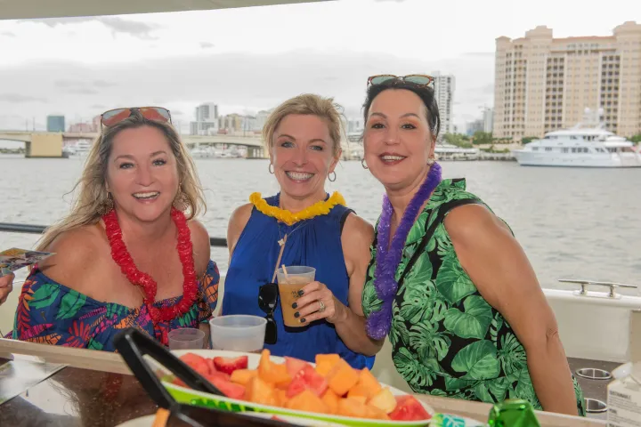 a woman standing in front of a picnic table