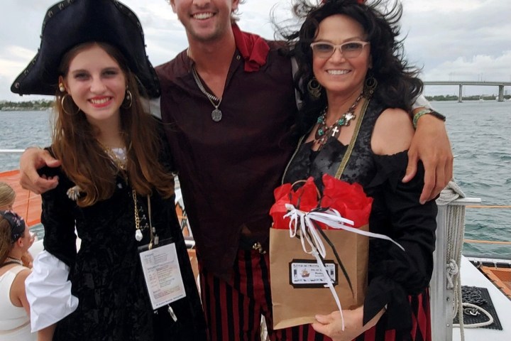 a couple of people that are standing in the snow