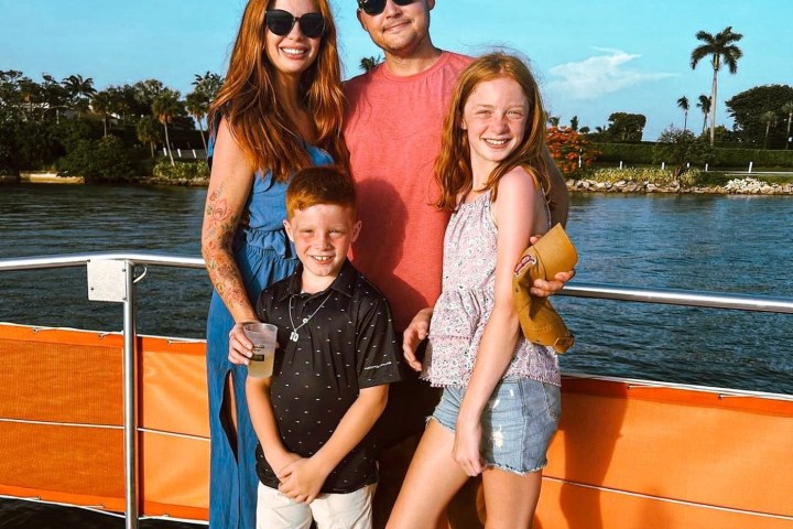 a person standing in front of a boat in the water