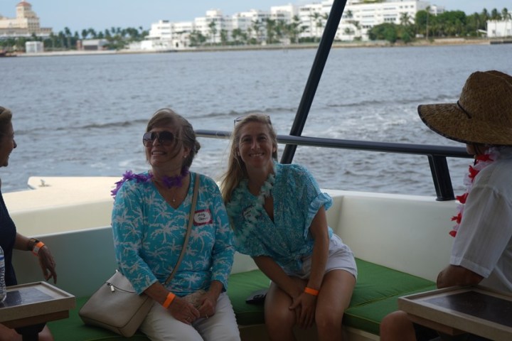 a group of people sitting at a picnic table
