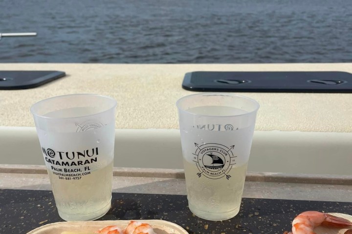 a tray of food and a cup of water