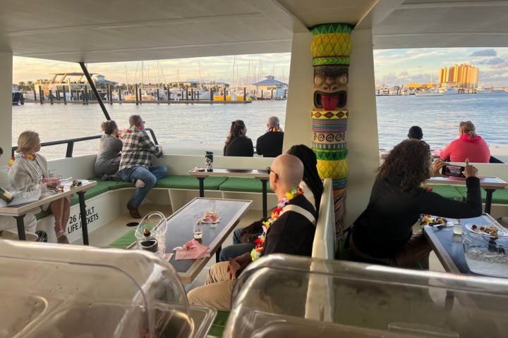 a group of people on a boat in the water