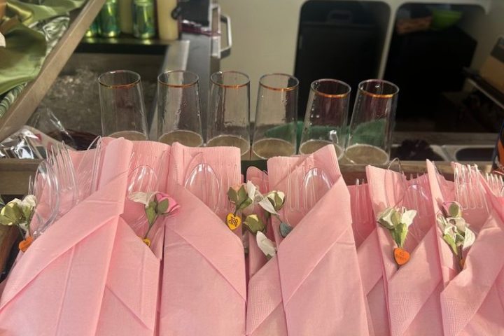 a group of pink flowers on a table