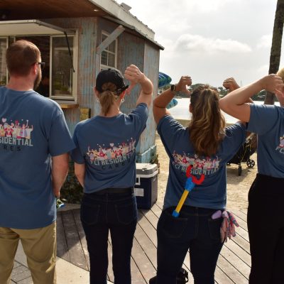 a group of people standing around each other