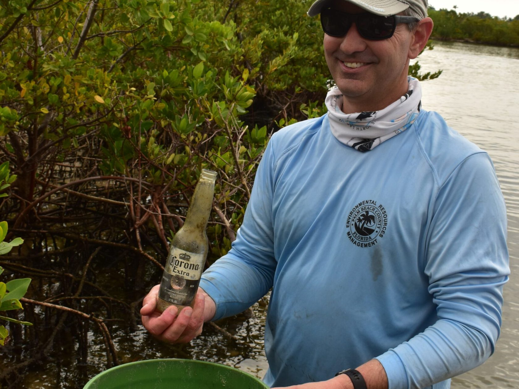 a man standing in front of a barrel