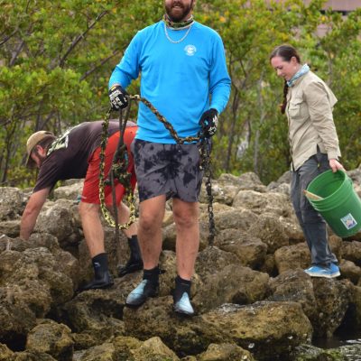 a group of people standing on a rock