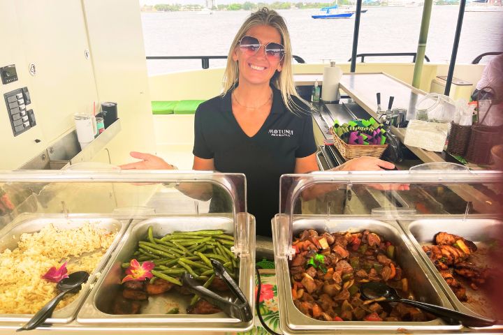a woman holding a tray of food