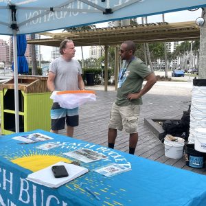 a man cutting a cake