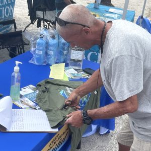 a man cutting a piece of paper