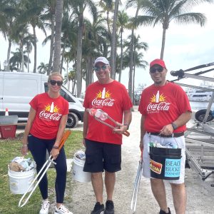 a group of people standing next to a tree