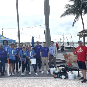 a group of people standing in front of a crowd posing for the camera