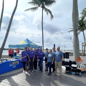 a group of people walking on a beach