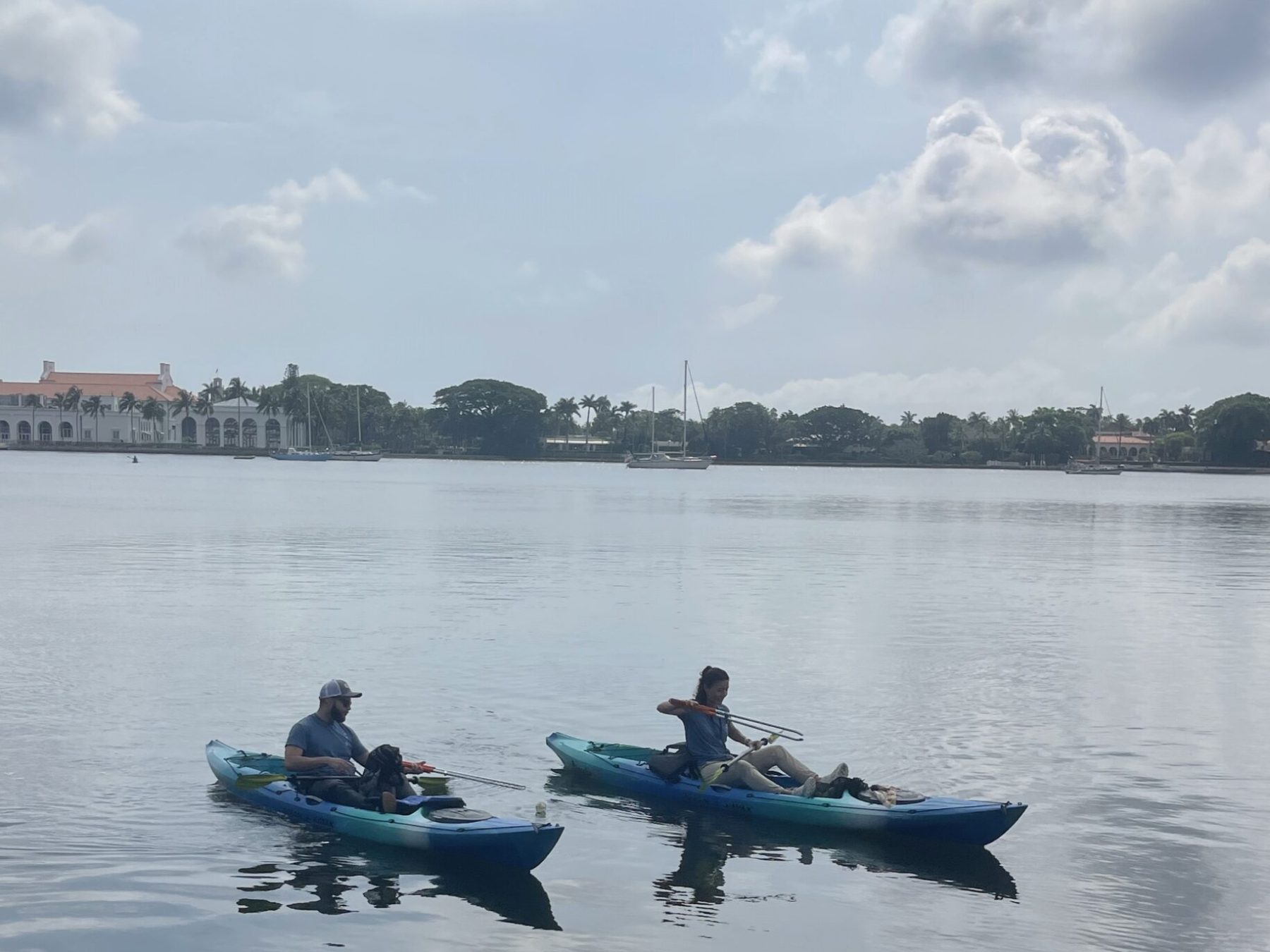 a group of people in a boat on a body of water