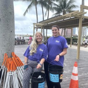 a man and a woman standing in front of a tree