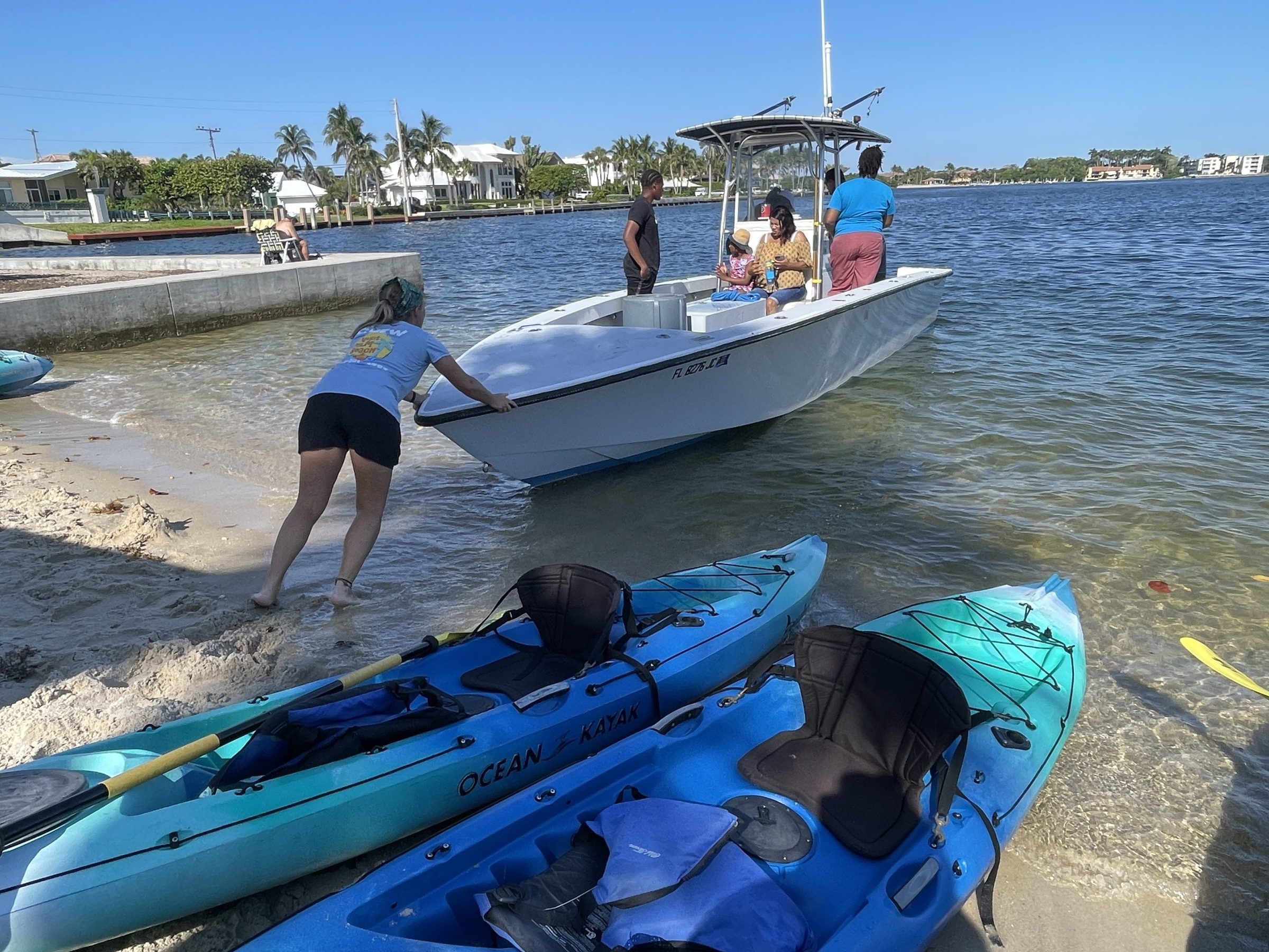 a group of people on a boat in the water