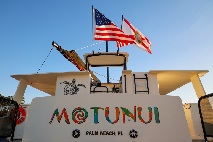 a sign in front of a cake