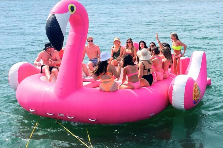 a group of people on a raft in a body of water