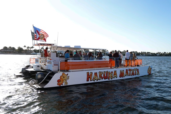 a group of people on a boat in a body of water