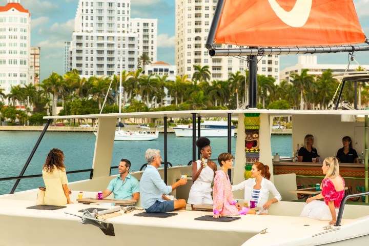 a group of people on a boat in the water