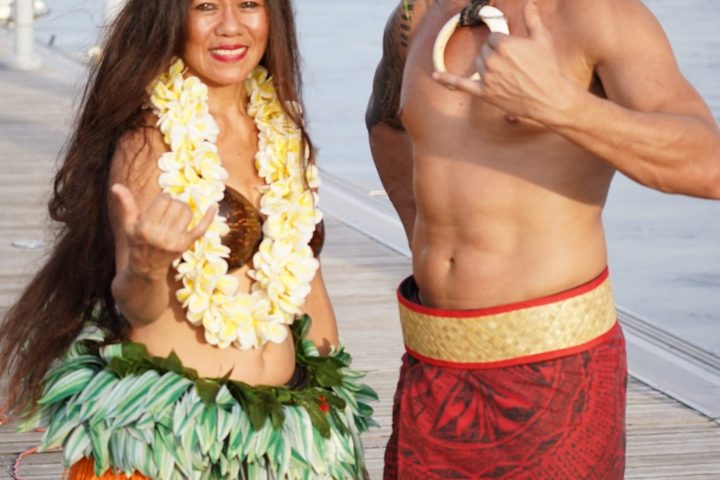 a couple of women standing next to a person