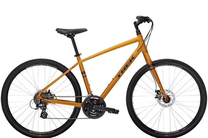 Orange hybrid bike with black tires on a white background.